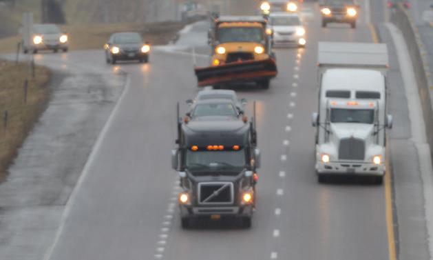 Trucks drive down I-70
